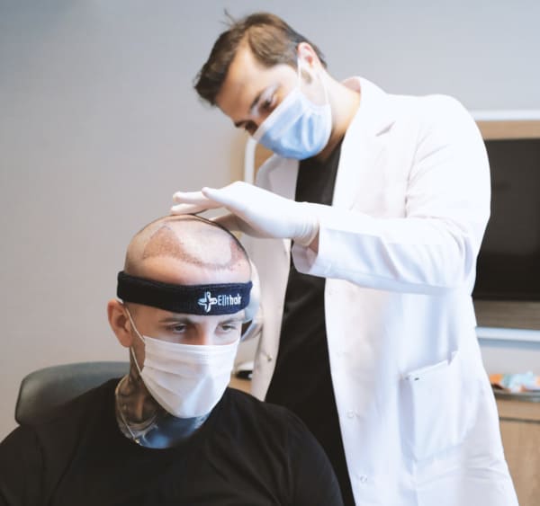 Dr Balwi examines a hair transplant patient