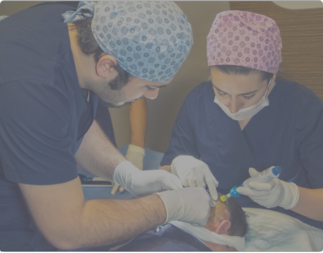 Dr Balwi observing the comfort in hair transplant anaesthesia being administered