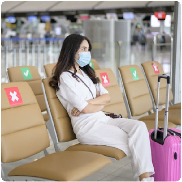 A girl waiting at the airport for her flight during corona