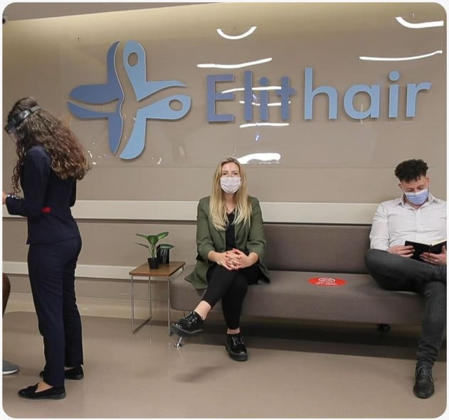 She waits with her mask on in the waiting area