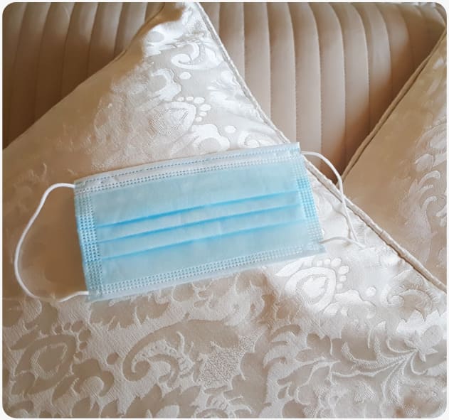 a face mask on the pillow at the hotel