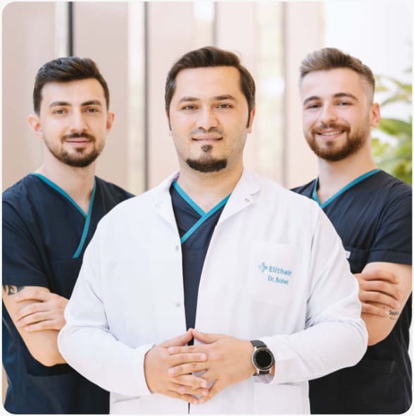 dr balwi with two members of his hair transplant team