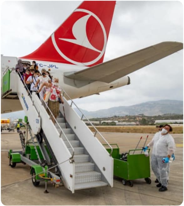 passengers leaving the aeroplane with turkish airlines