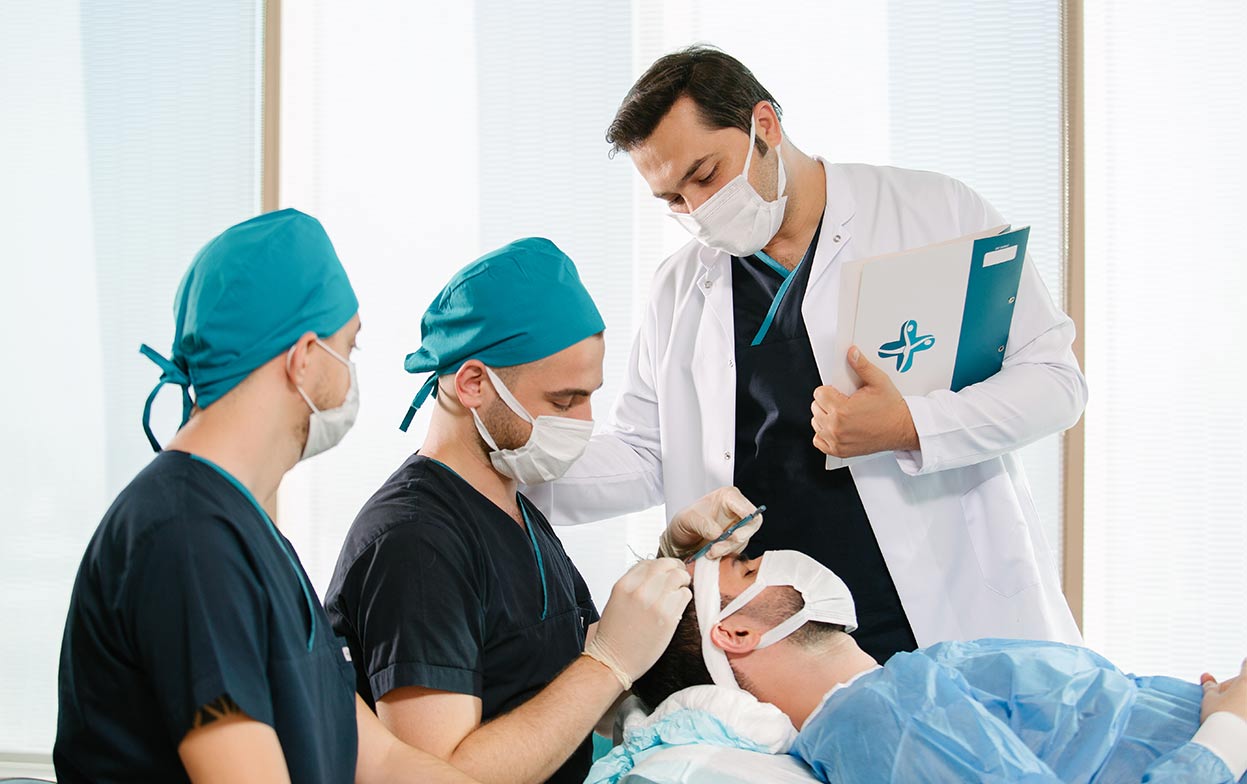 Dr. Balwi and his team performing a hair transplant operation at Elithair