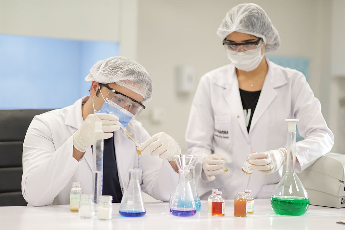 picture of Dr. Balwi designing the NEO FUE serum in a laboratory