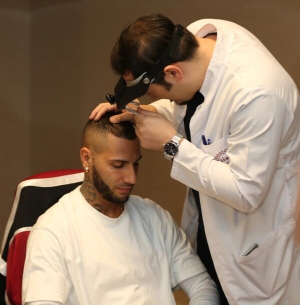 Dr Balwi consulting with Patient Quaresma
