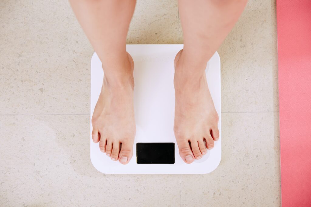 Feet on scales as woman is checking her weight