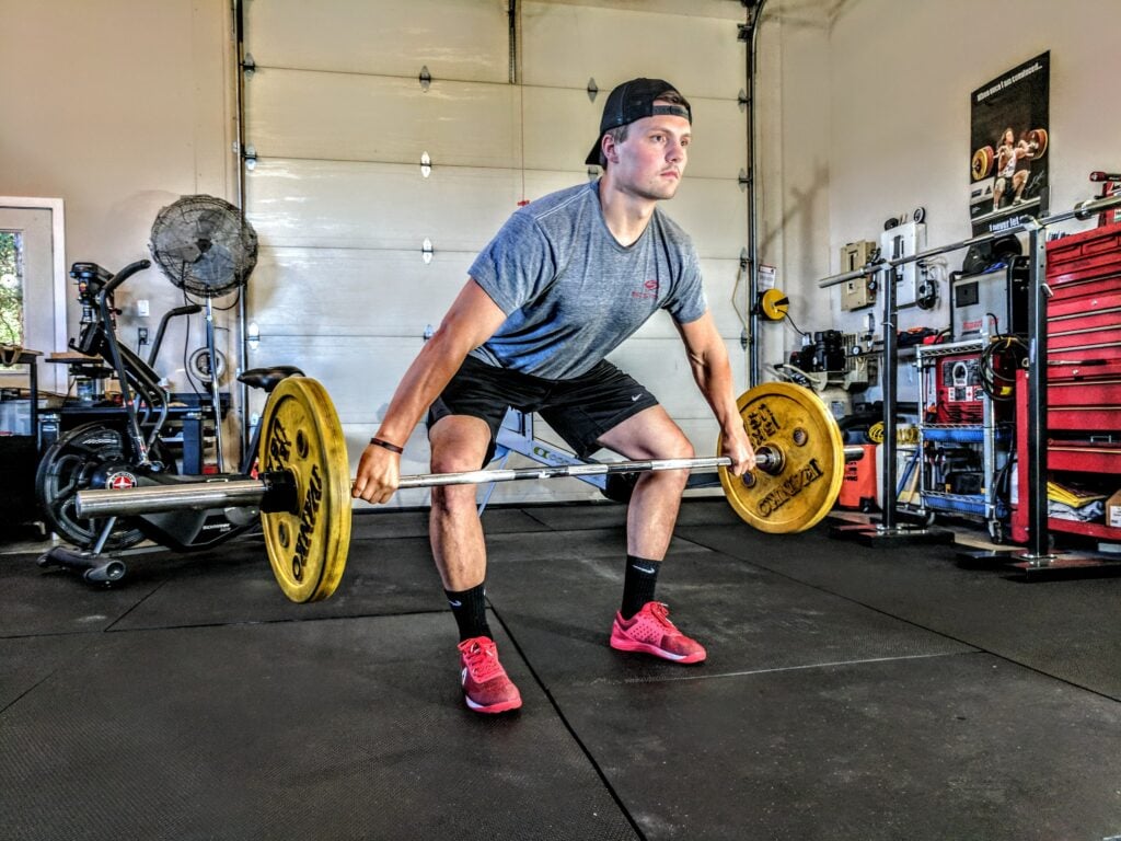 Man working out wondering does creatine cause hair loss