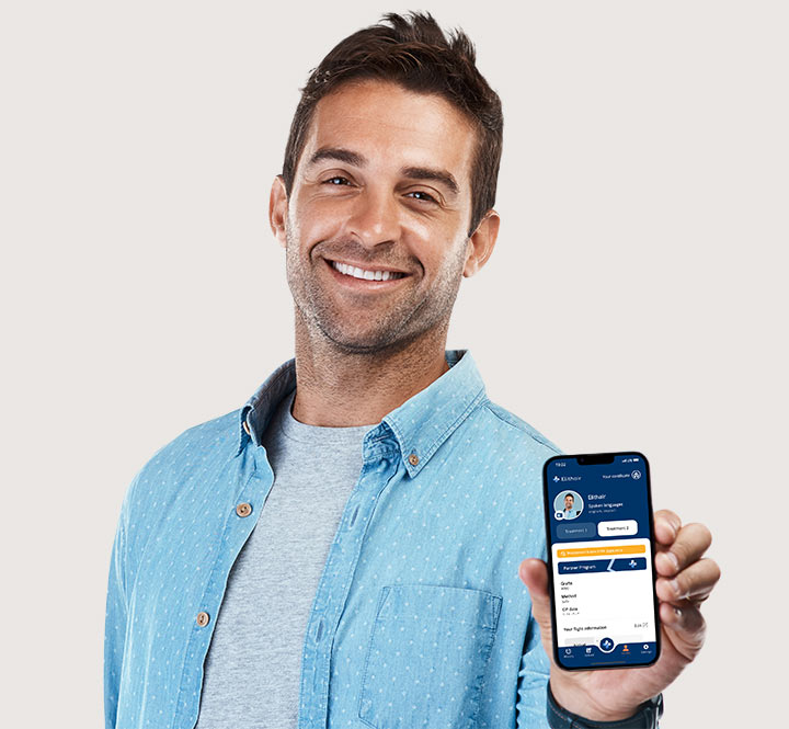 Elithair patient smiling while showing the Elithair app on his phone