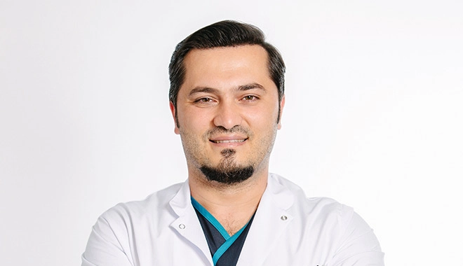 Profile pic of Dr. Balwi smiling to the camera
