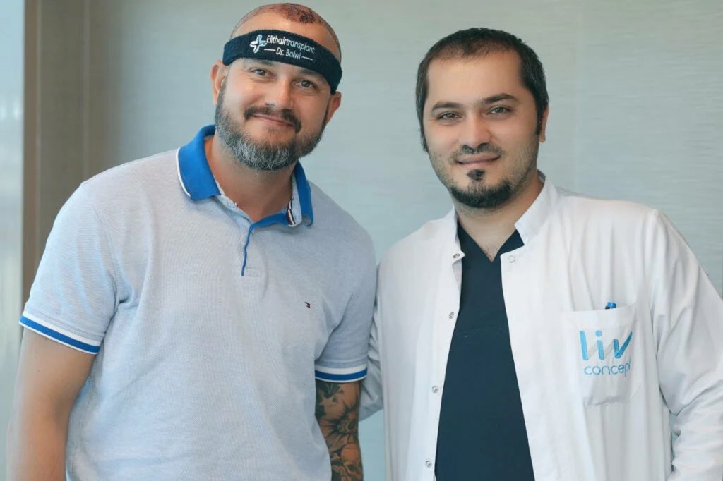 Hair transplant patient posing with Elithair medical director Dr. Balwi.