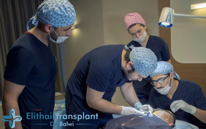 A team of Elithair specialists conduct a hair transplant on a patient.