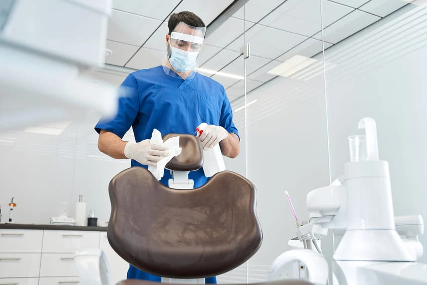 A member of Elithair staff disinfects the operating room.