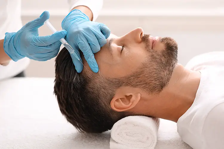 A man receiving PRP treatment for hair loss