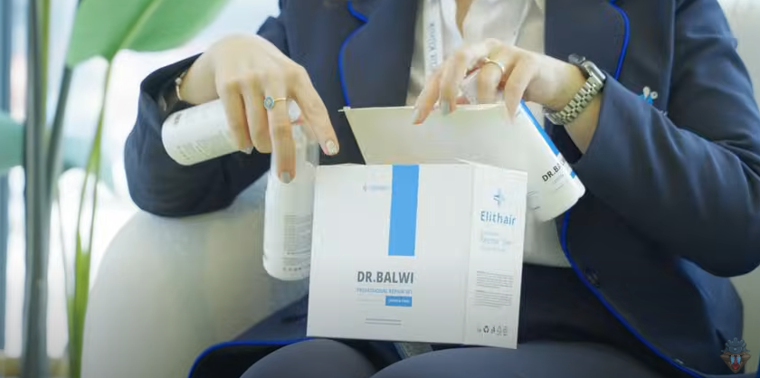 A member of Elithair staff provides Skill4ltu with Dr Balwi products for use in his post-operative recovery.