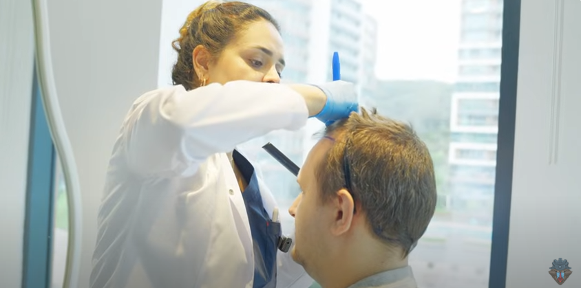 Skill4ltu is prepped for surgery by an Elithair member of staff.