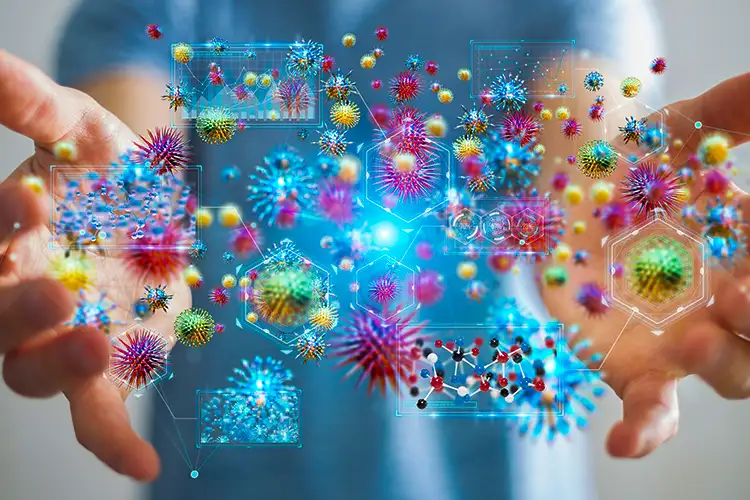 A person is viewed from the chest down. Their hands are outstretched, revealing an illustration of various colourful molecules.