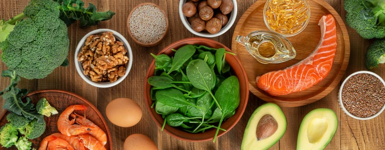 A variety of protein-rich foods that promotes haior growth, including salmon, avocado, and spinach.