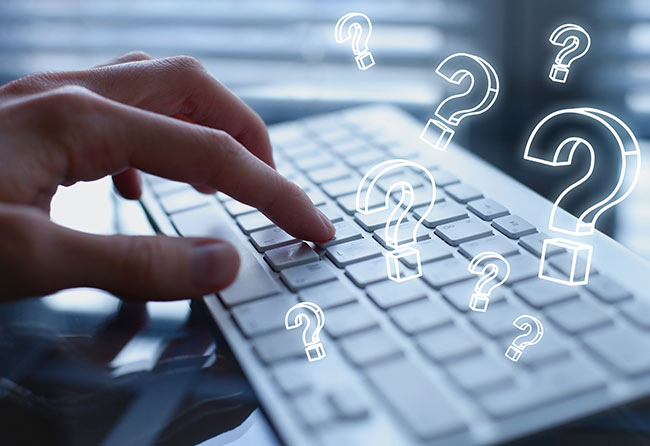 Hand Typing on Keyboard for FAQ
