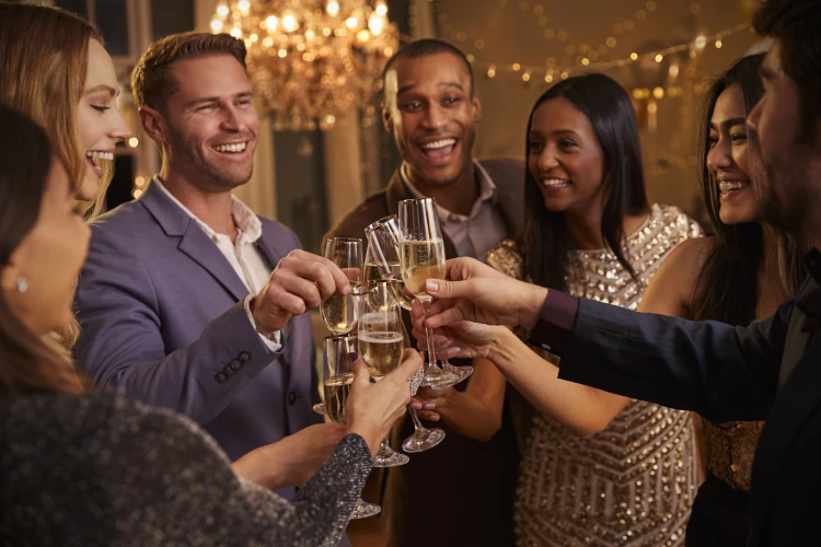 A group of happy friends toasting with champagne at a party.