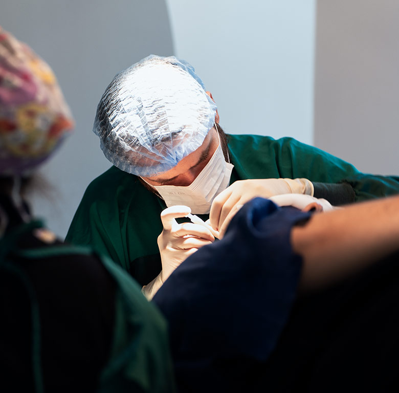 Patient in Operating Room for Hair Transplant with Doctor