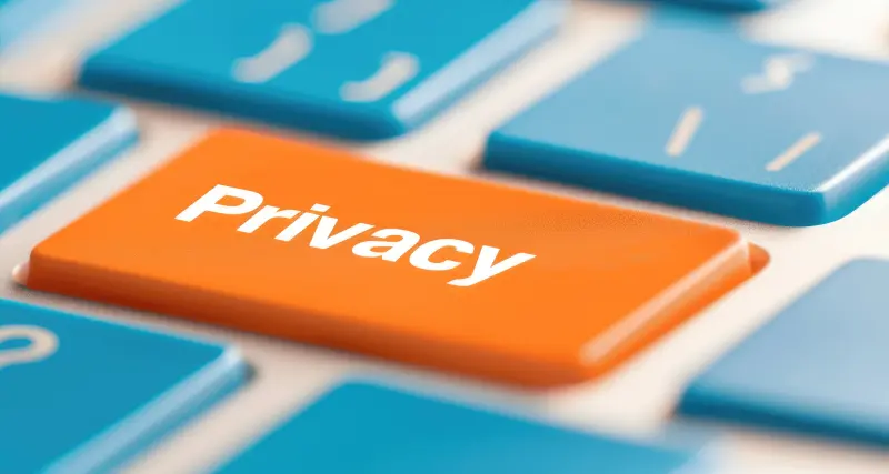 An orange key in a computer keyboard titled Privacy