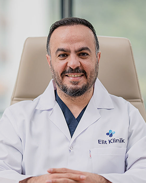 Doctor Imad Moustafa, Elithair's senior hair surgeon, seated confidently in a bright and modern medical office.
