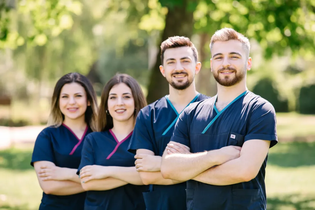 Pic shows four of the Elithair Specialists team outside in front of a tree with their arms crossed